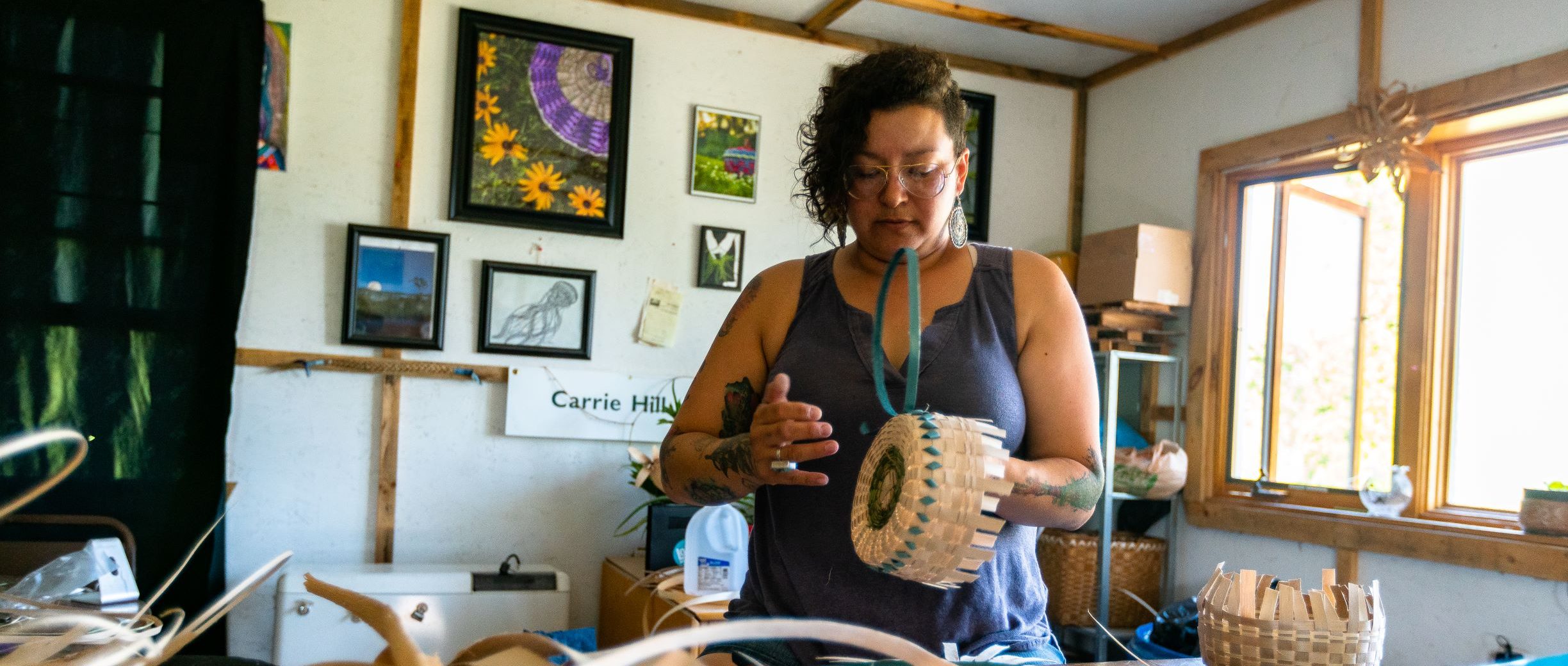 An Akwesasne native, Carrie Hill weaves black ash and sweetgrass Mohawk baskets. This basketmaking tradition goes back generations in her family using materials found in Akwesasne.